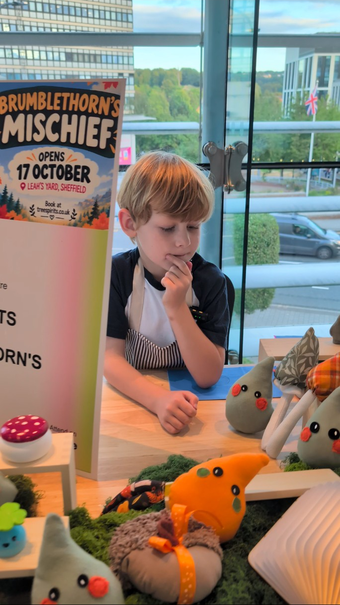 Oliver with the Tree Spirits display and Brumblethorn’s Mischief poster.